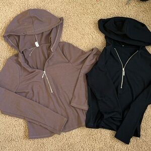 Quarter-zip light weight tight fitting jackets.